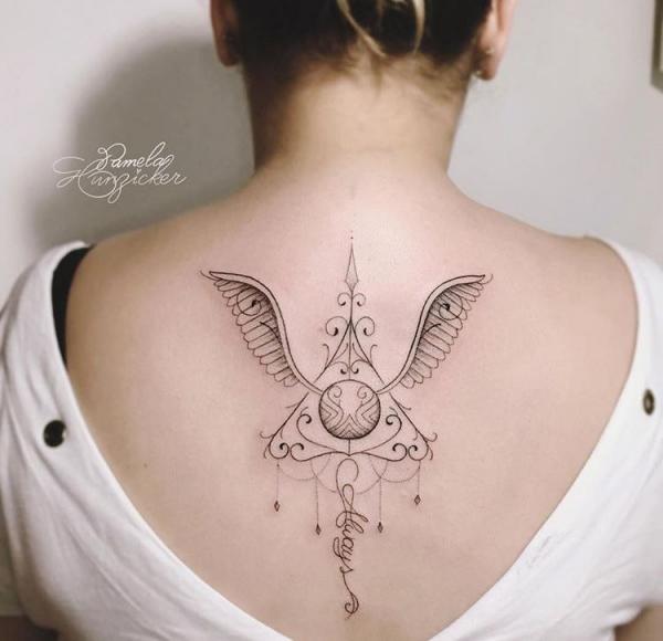 Feminine Golden Snitch and deathly hallows back tattoo
