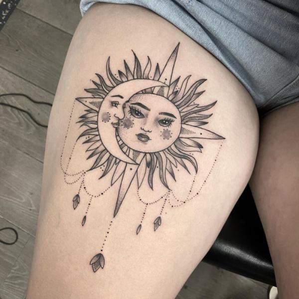 Feminine sun and moon with pendant thigh tattoo