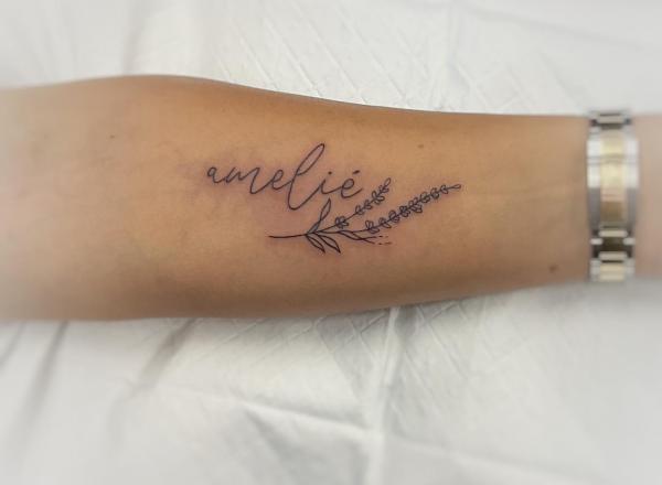 Fine line lavender tattoo with name