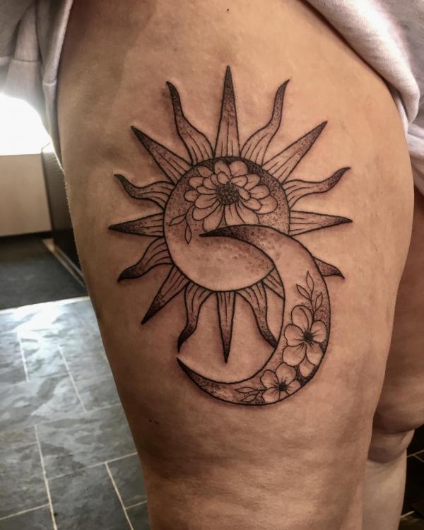 Floral moon and sun thigh tattoo
