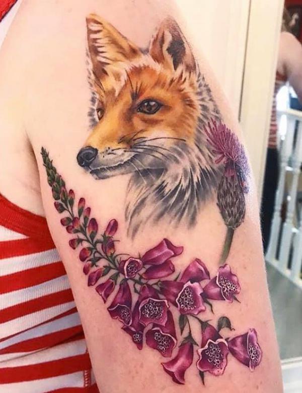 Fox and foxglove upper arm tattoo