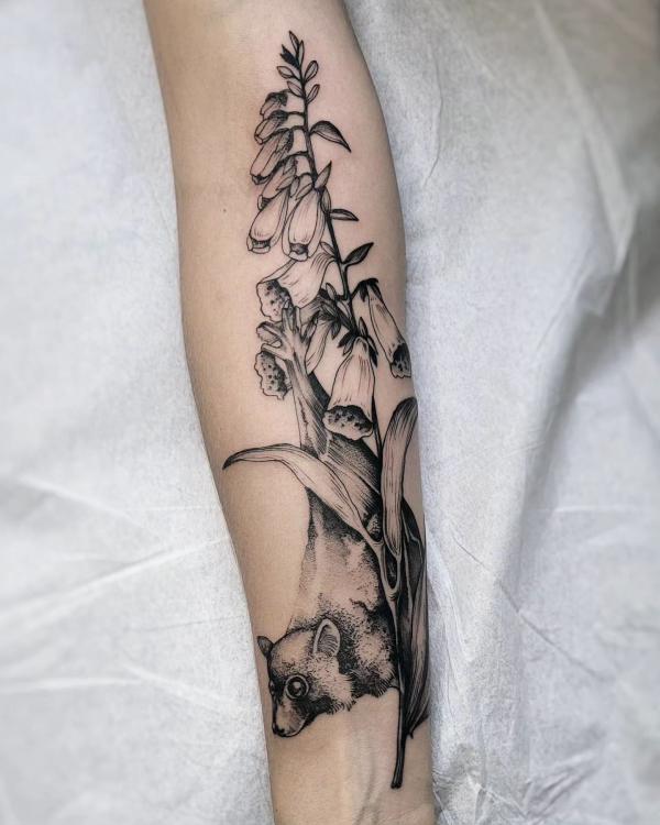 Foxglove and bat tattoo black and grey