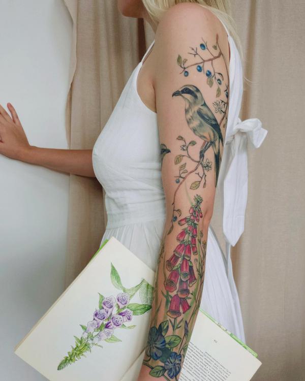 Foxglove and bird tattoo sleeve