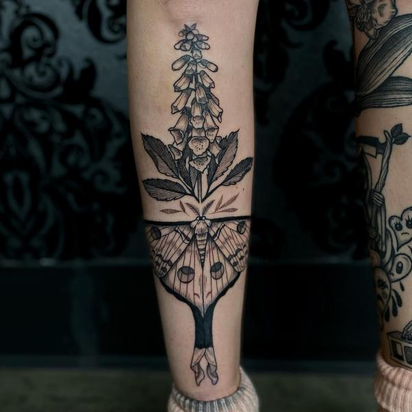 Foxglove and moth lower leg tattoo