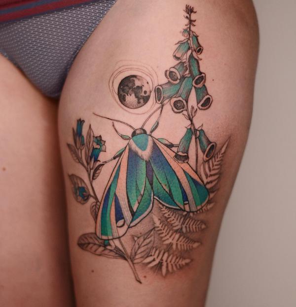 Foxglove and moth tattoo on thigh