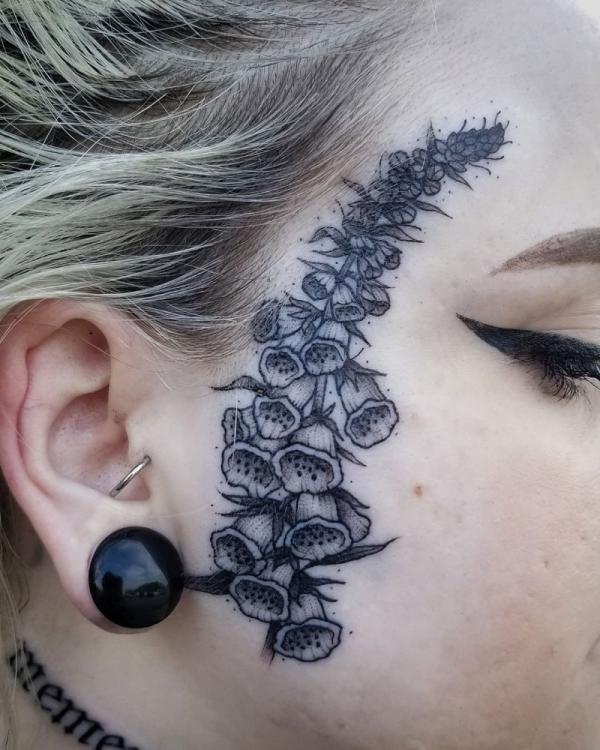 Foxglove face tattoo