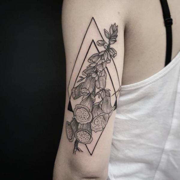 Geometric foxglove back of arm tattoo