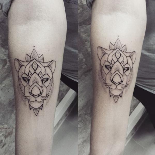 Geometric lioness forearm tattoo