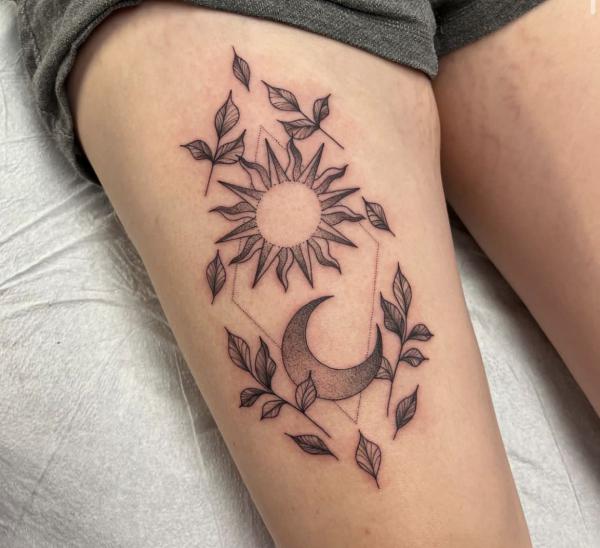 Geomtric sun and moon with leaves thigh tattoo