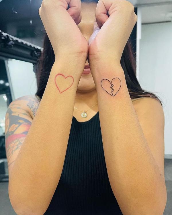 Heart and broken heart outline tattoo