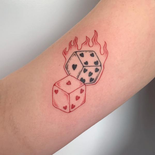 Heart dice in flame tattoo