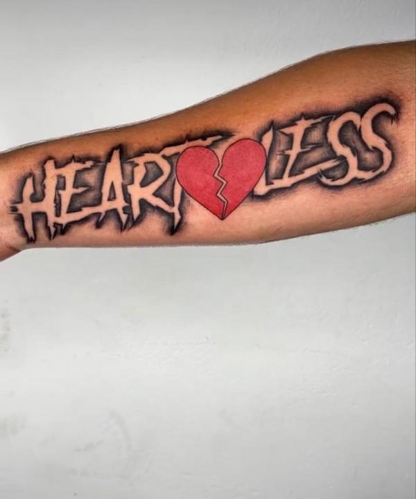 Heartless broken heart forearm tattoo