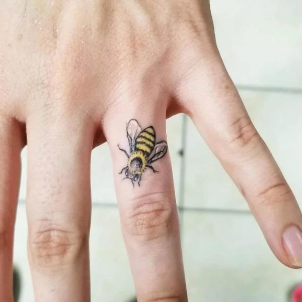 Honey Bee finger tattoo