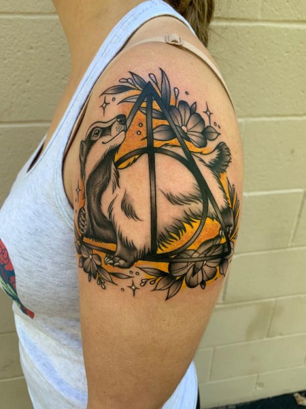 Hufflepuff badger and deathly hallows shoulder tattoo