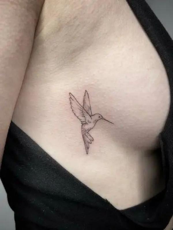 Hummingbird side boob tattoo