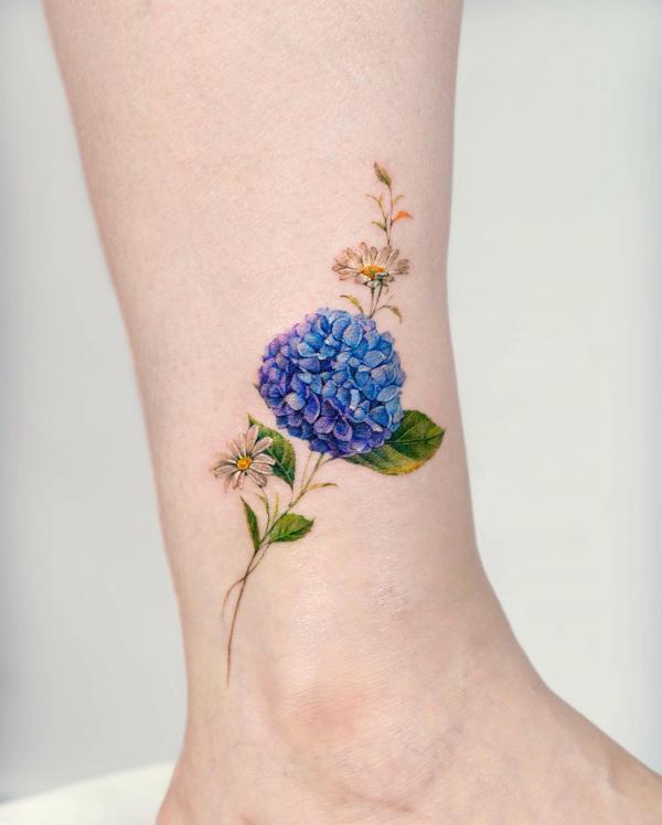Hydrangea and daisy ankle tattoo