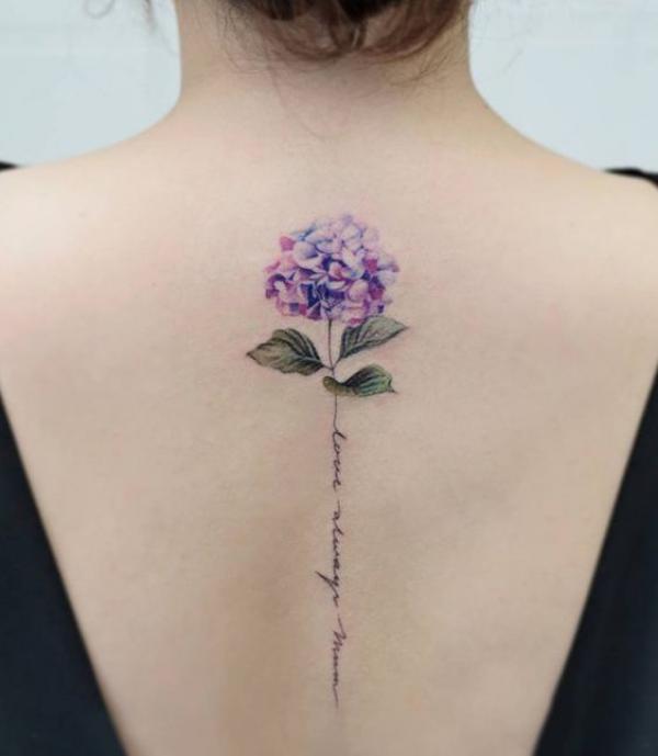 Hydrangea with words along spine tattoo