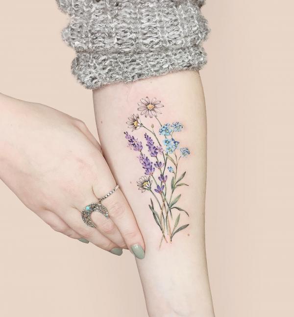 Lavender and daisy flower tattoo