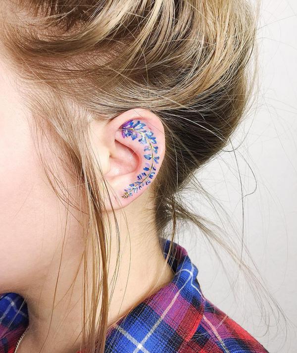 Lavender inner ear tattoo
