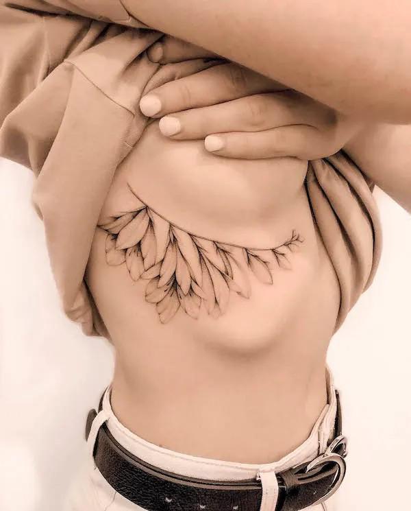 Leaves side boob tattoo