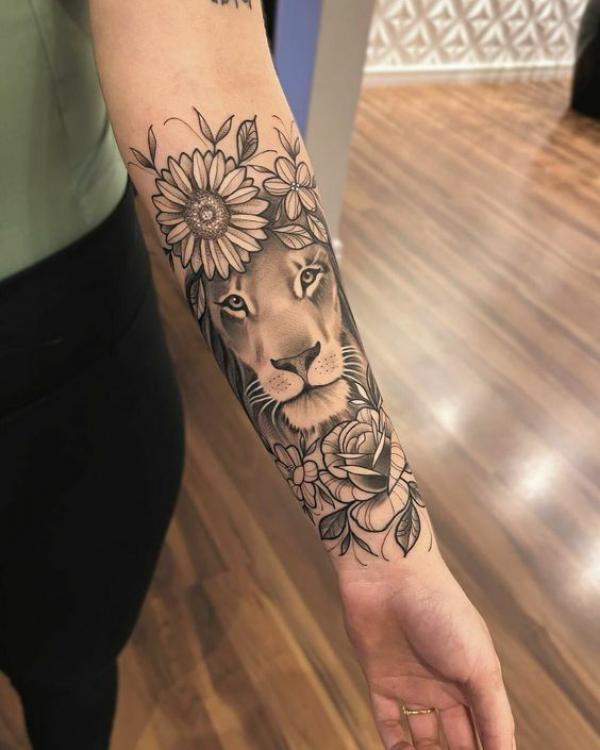 Leo lioness with rose and sunflower tattoo