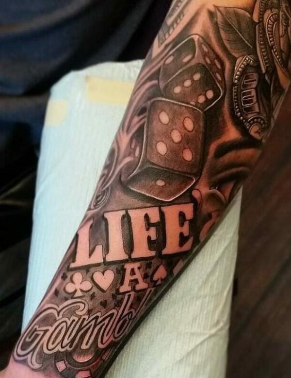 Lifes A Gamble Tattoo forearm