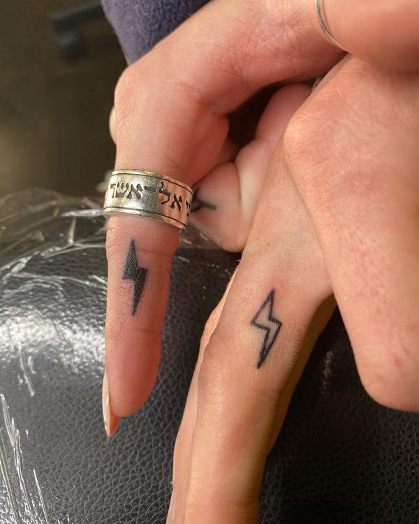 Lightning bolt Ink on the side of finger