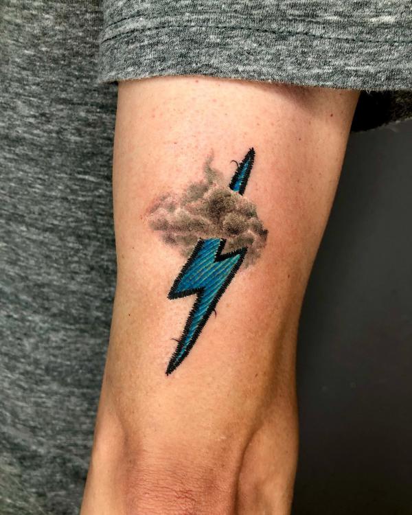 Lightning bolt patch tattoo with clouds