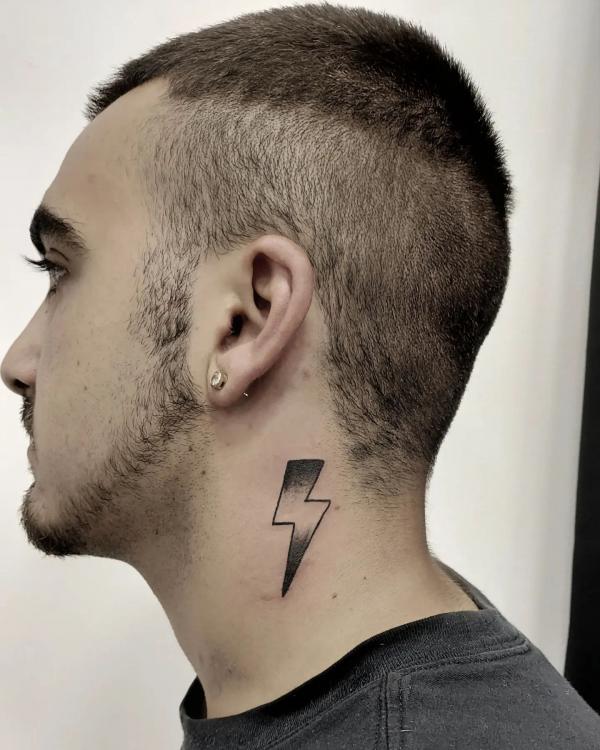 Lightning bolt tattoo on the side of neck