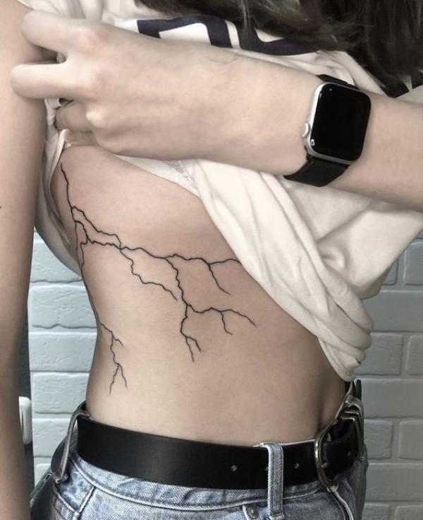 Lightning side boob tattoo