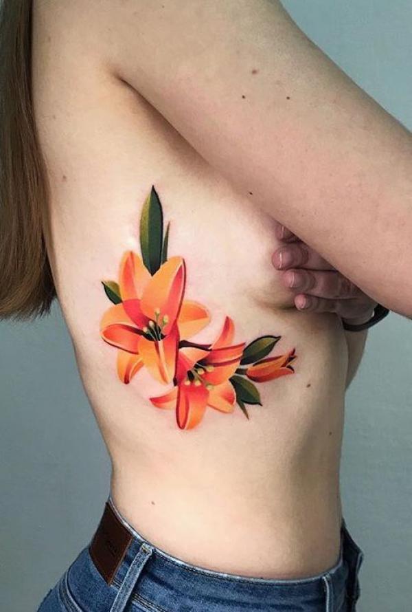 Lily flower side boob tattoo