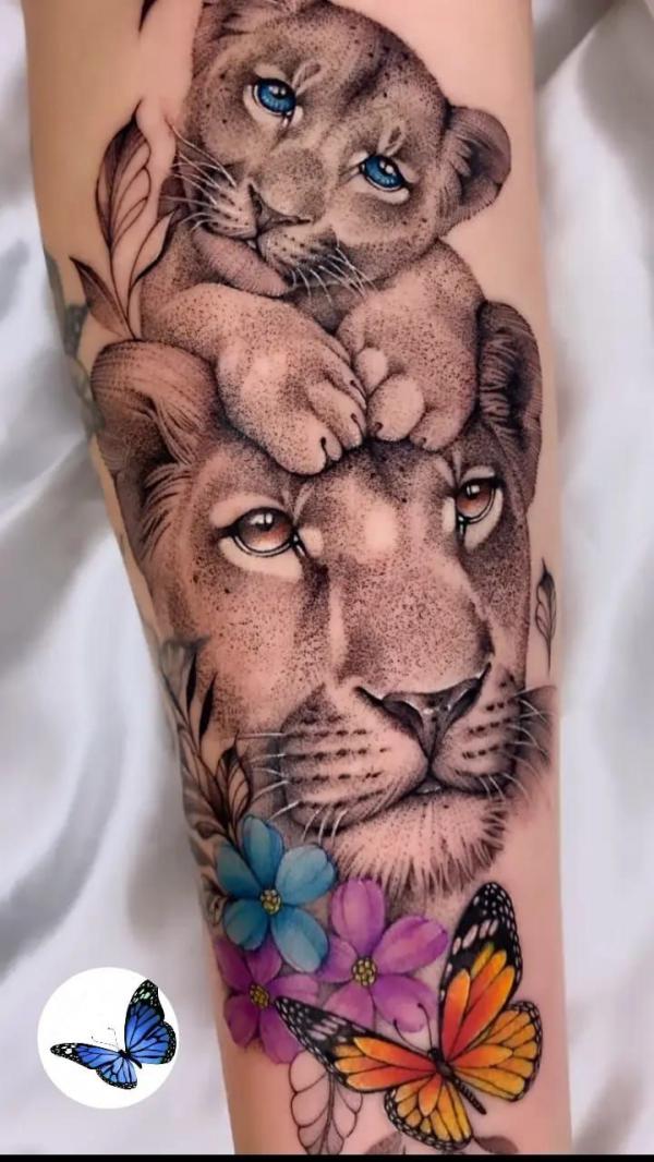 Lioness and cub with flowers and butterfly tattoo