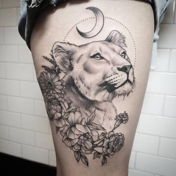 Lioness and flower with crescent moon tattoo