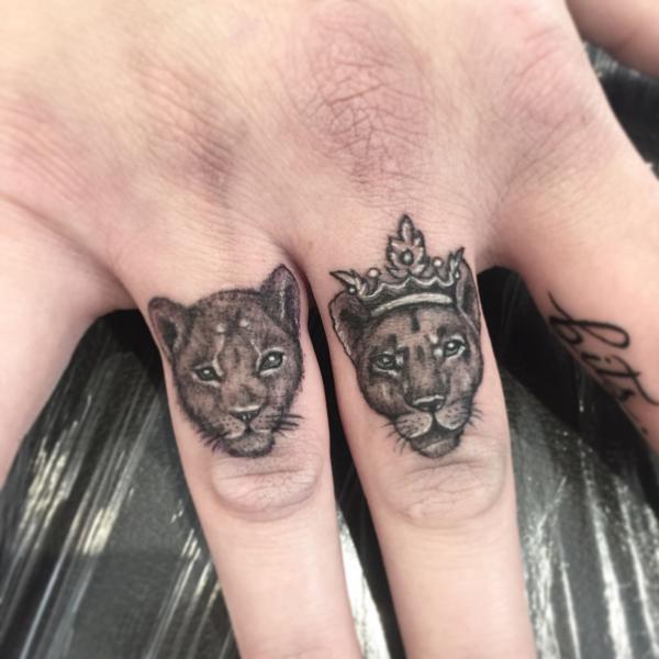 Lioness finger tattoo