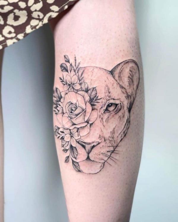 Lioness head and rose tattoo