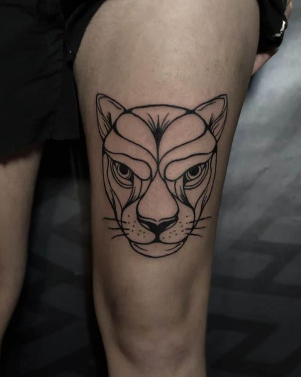 Lioness outline tattoo above knee