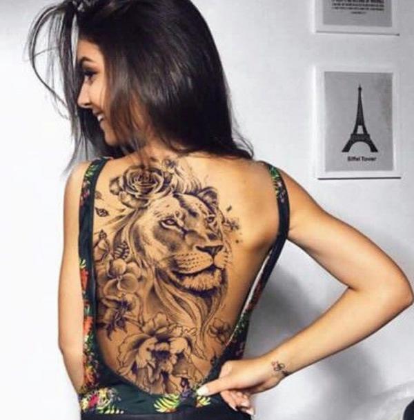 Lioness with flower back tattoo