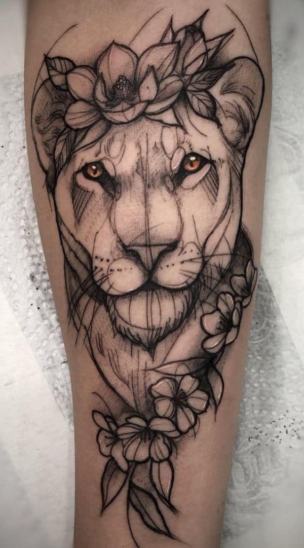 Lioness with flower sketch tattoo