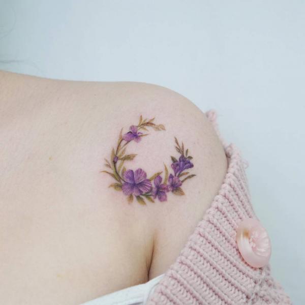 Lovely violet wreath on shoulder