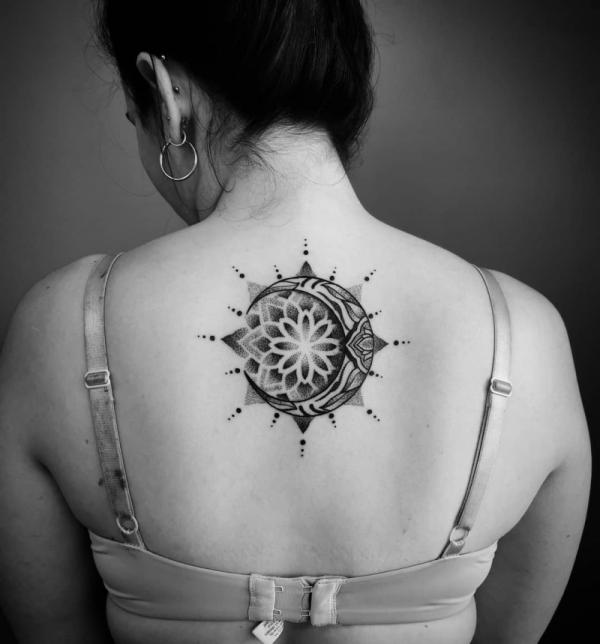 Mandala sun and moon dotwork back tattoo