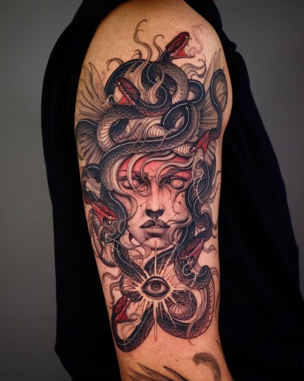 Medusa with eye tattoo on upper arm 1