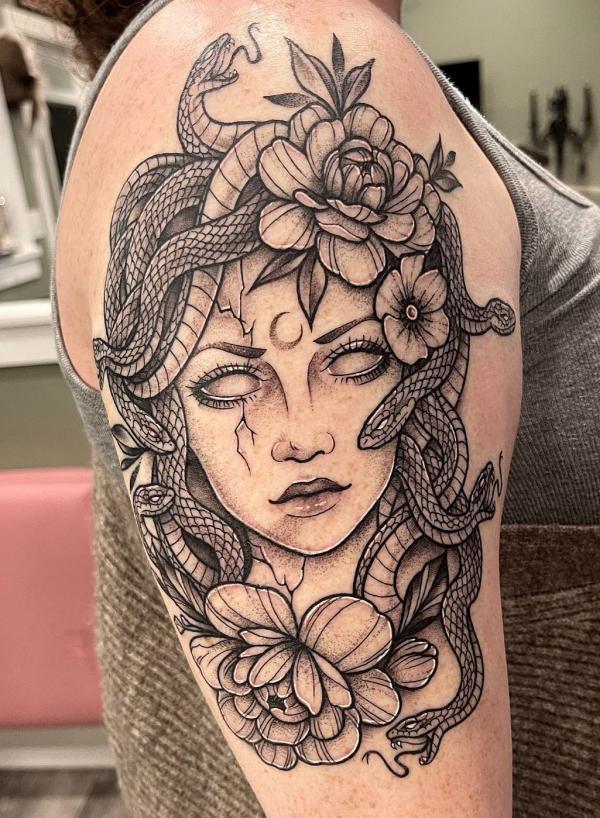 Medusa with peony upper arm tattoo 1