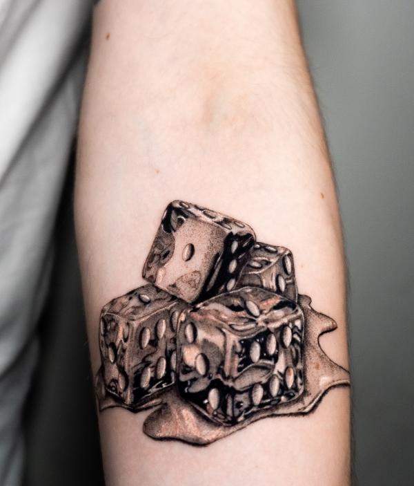 Melted dices tattoo