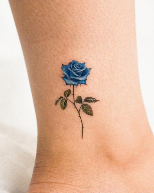 Minimalist blue rose ankle tattoo