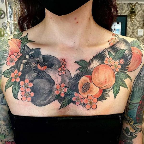 Neo traditional Racoon eating peach chest tattoo