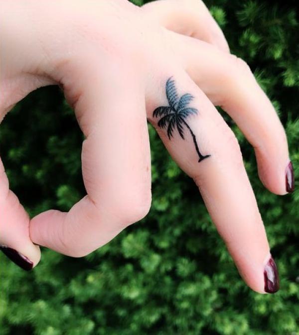 Palm tree finger tattoo