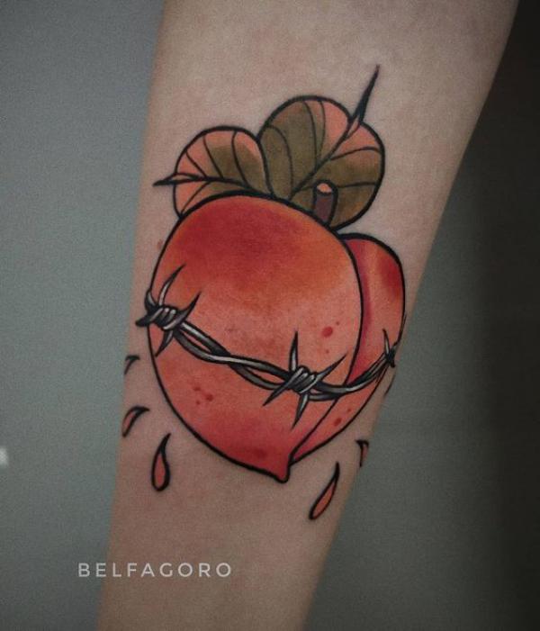 Peach and barbed wire tattoo