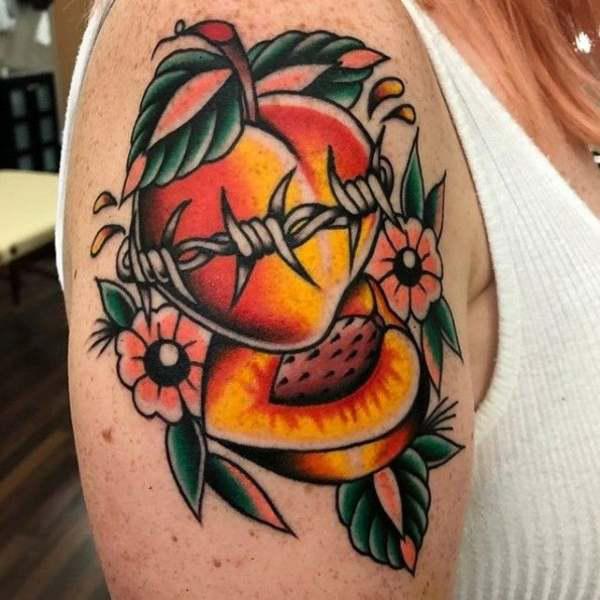 Peach wrapped with barbed wire tattoo
