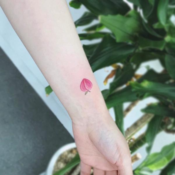 Pink peach wrist tattoo