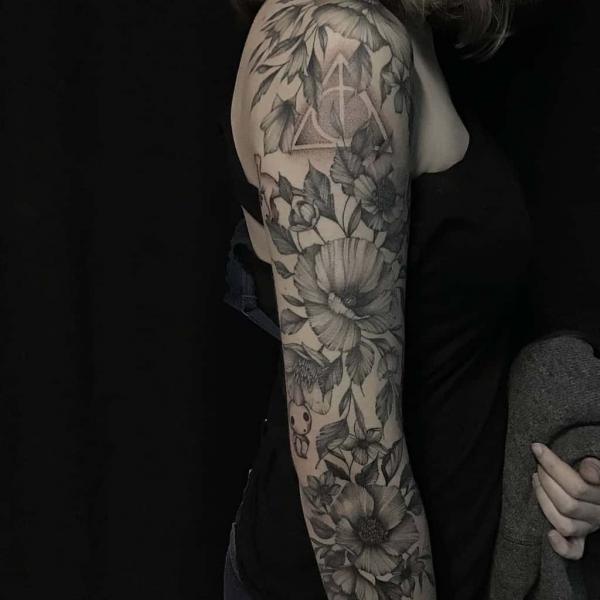 Poppy flowers with deathly hallows full sleeve tattoo